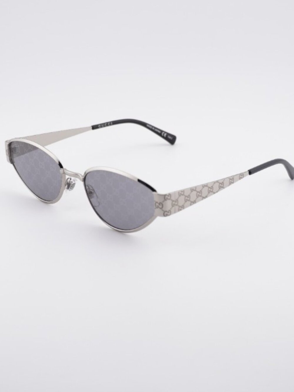 Gucci GG1853S 002 Sunglasses Silver Oval Frame, Grey with GG Pattern Lenses